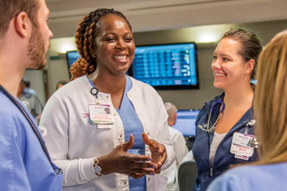 Photo of a group of nurses speaking together in a hospital